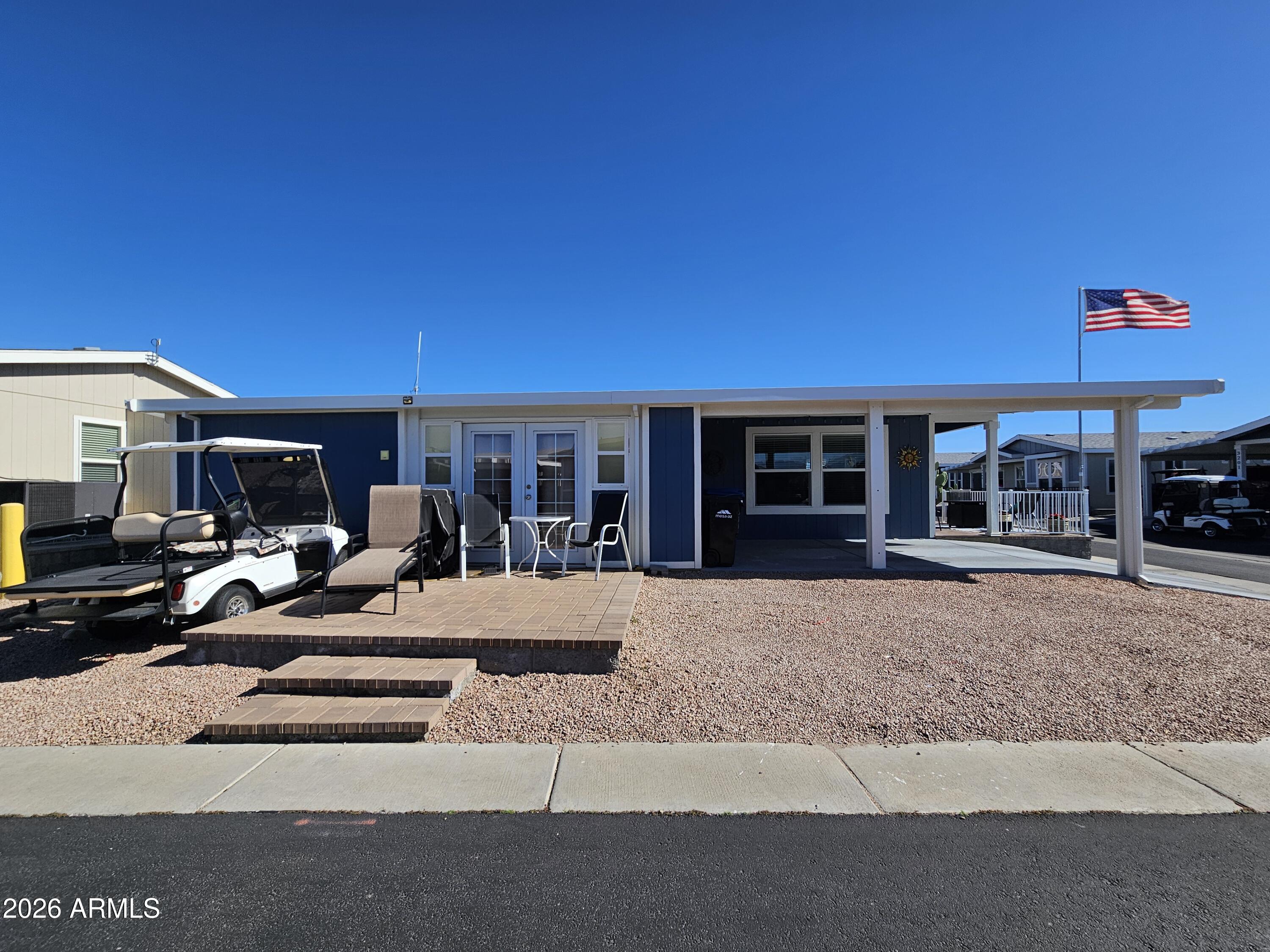 650 North Hawes Road, Unit 3202 Mesa, AZ 85207 - Photo 2 of 35 a view of a house with backyard porch and sitting area