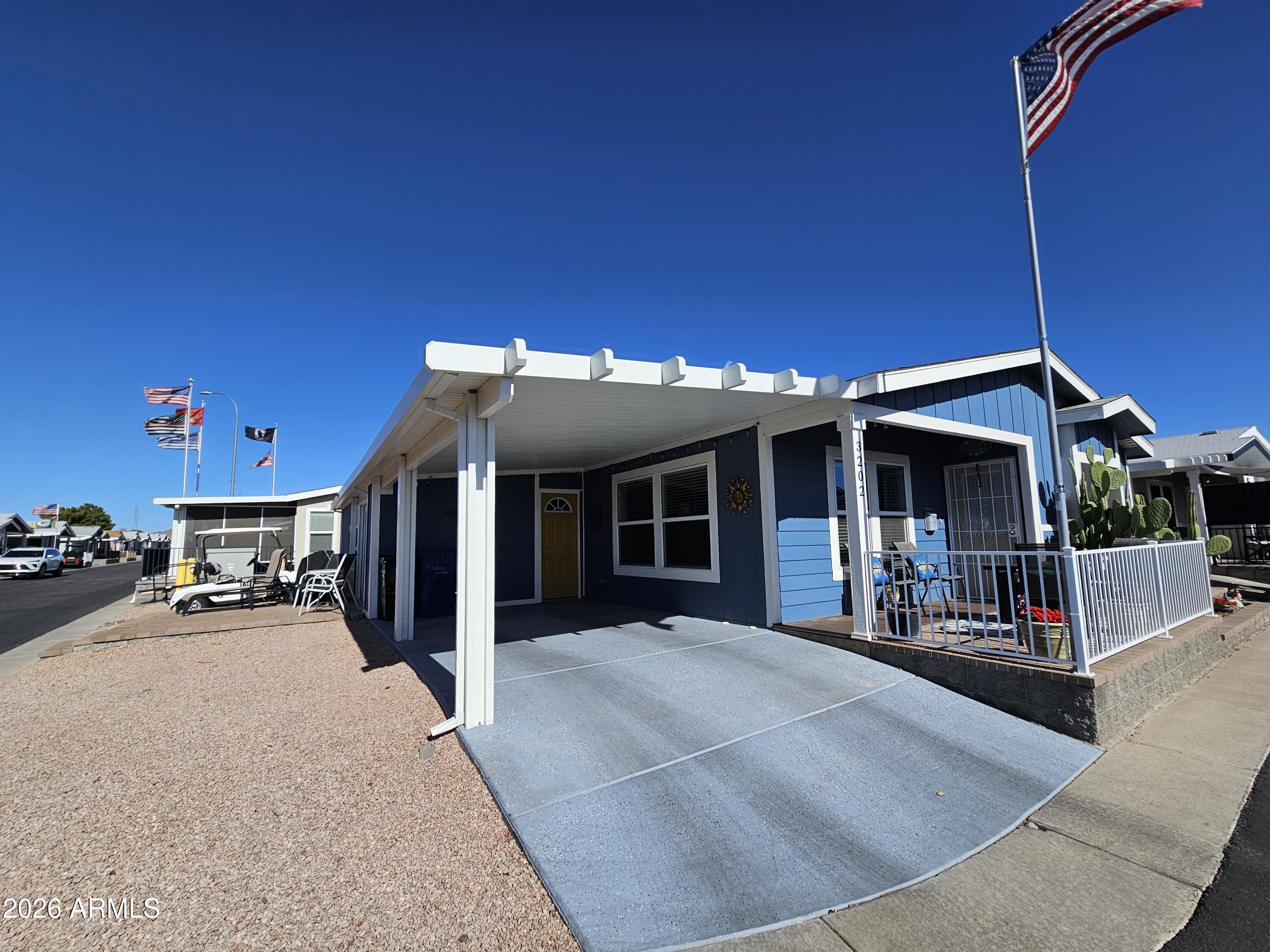 650 North Hawes Road, Unit 3202 Mesa, AZ 85207 - Photo 3 of 35 a view of a house with large windows and furniture