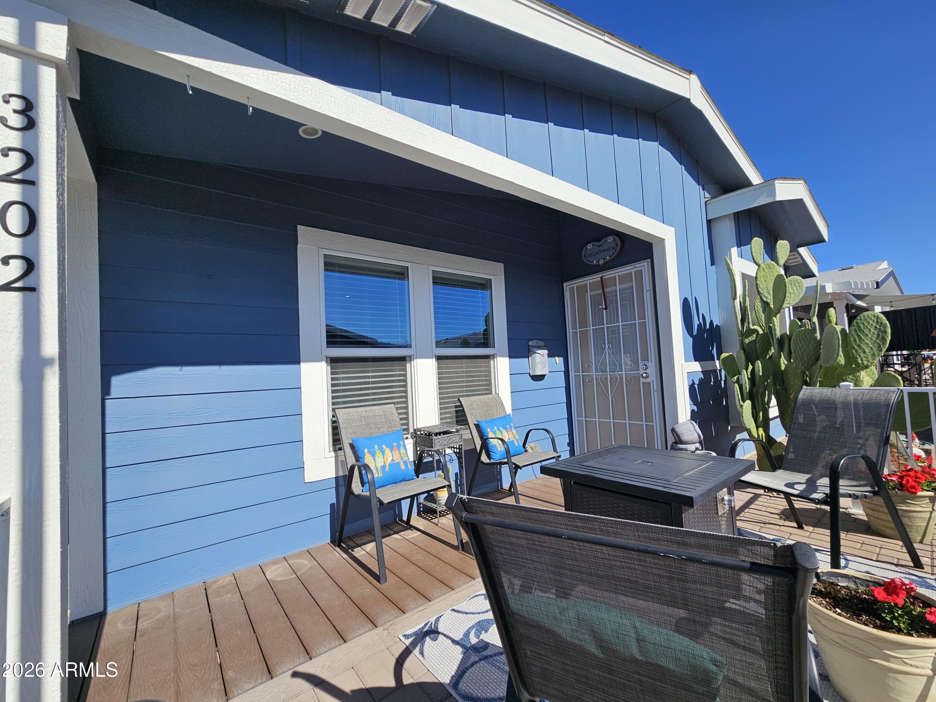 650 North Hawes Road, Unit 3202 Mesa, AZ 85207 - Photo 5 of 35 a view of backyard with outdoor seating and wooden floor