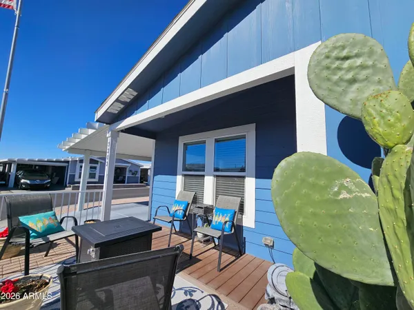 a view of a chairs and table in patio