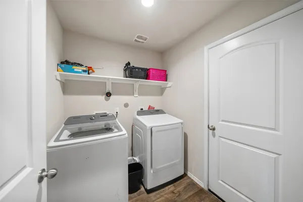 a front view of house with a garden and patio