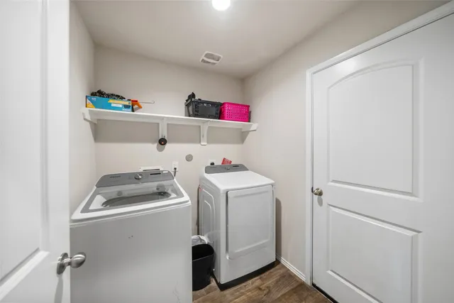 a front view of house with a garden and patio