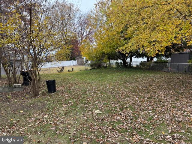65 Tilford Road Somerdale, NJ 08083 - Photo 2 of 3 a view of a tree in front of a house with large trees