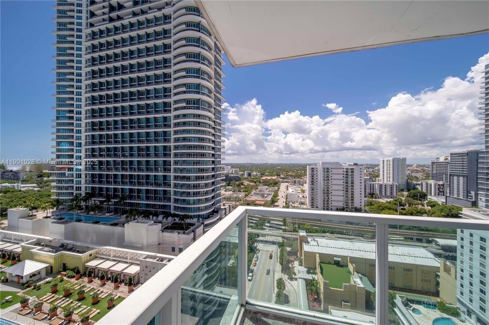 1250 South Miami Avenue, Unit 2201 Miami, FL 33130 - Photo 27 of 30 a view of a balcony with two chairs and a table