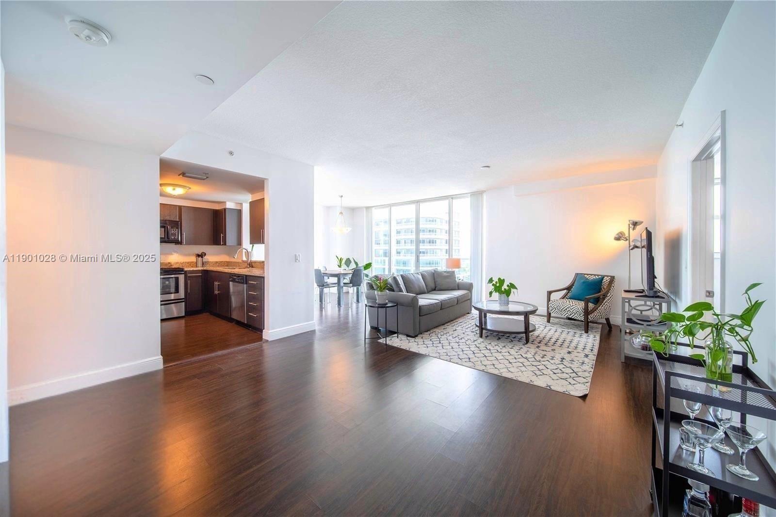 1250 South Miami Avenue, Unit 2201 Miami, FL 33130 - Photo 30 of 30 a living room with furniture and wooden floor