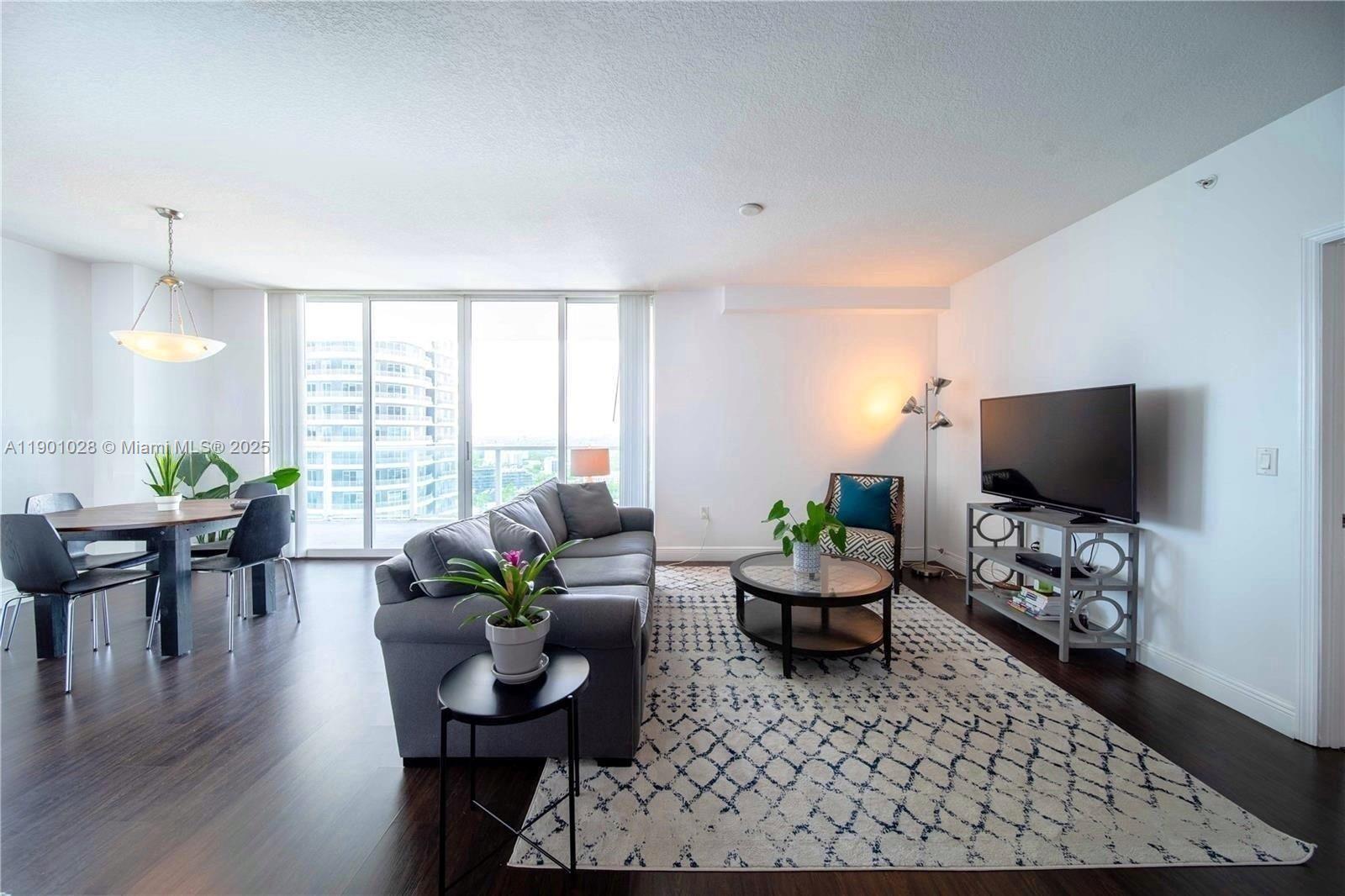 1250 South Miami Avenue, Unit 2201 Miami, FL 33130 - Photo 8 of 30 a living room with furniture and a flat screen tv
