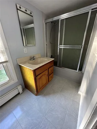 a room with washing machine and window