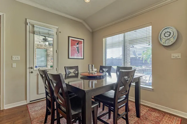 a room with furniture pool table and windows