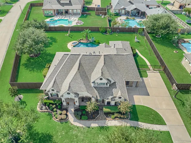 a garden with trees in front of it