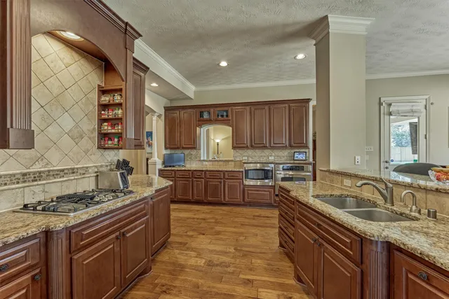 a bedroom with a bed a table and chair