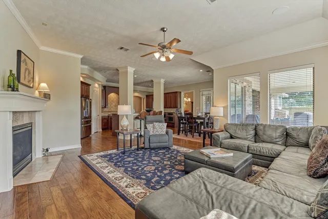 a bedroom with a bed and painting on the wall