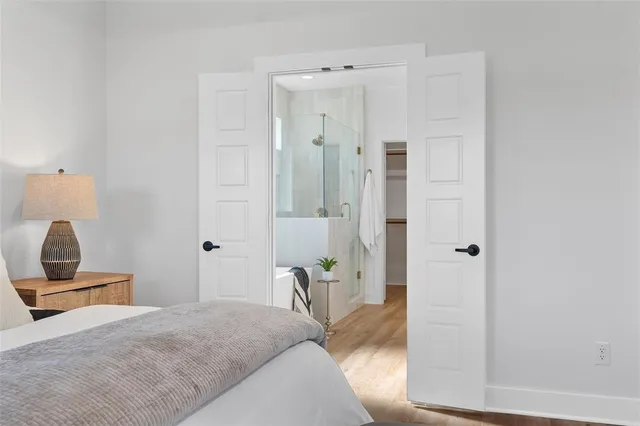 a bedroom with a bed and a mirror