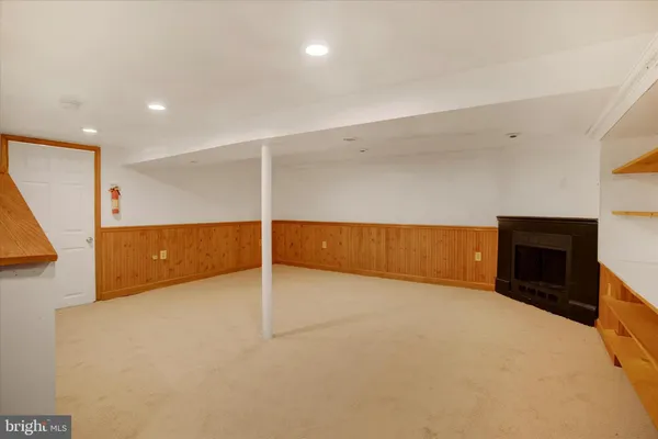 a view of an empty room with a fireplace