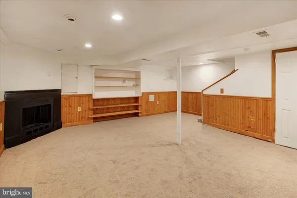 a view of an empty room with a fireplace