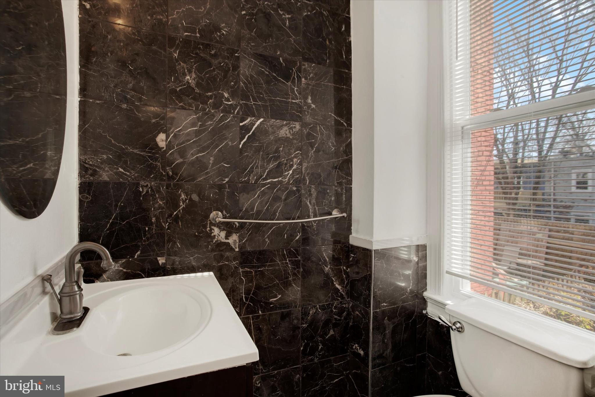 637 M Street Northeast Washington, DC 20002 - Photo 5 of 15 a bathroom with a sink toilet and shower