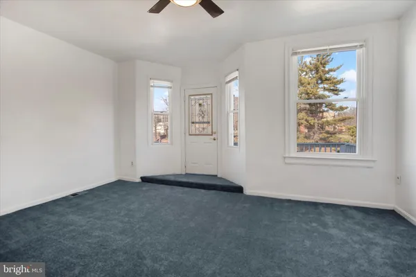 an empty room with windows