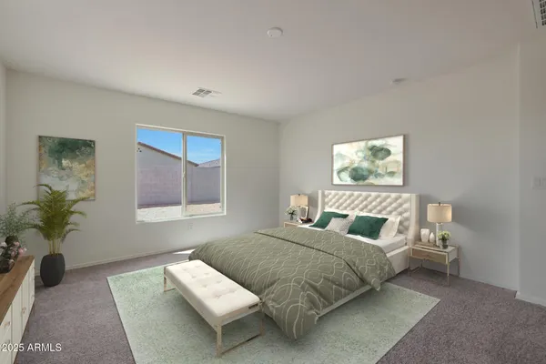 a bedroom with a bed and a couch
