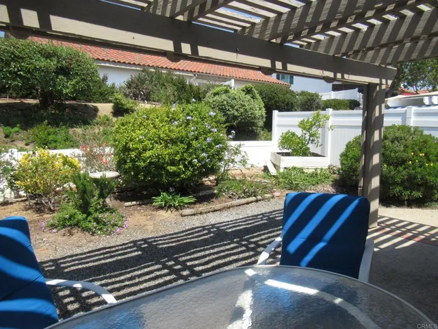 a bathroom with a sink mirror and a shower