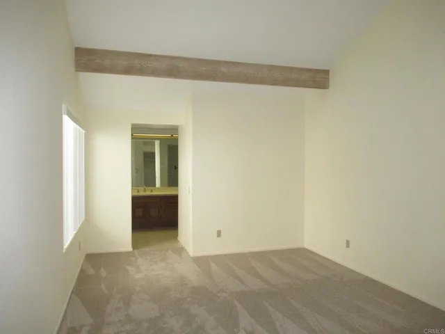 a view of a car park in front of house