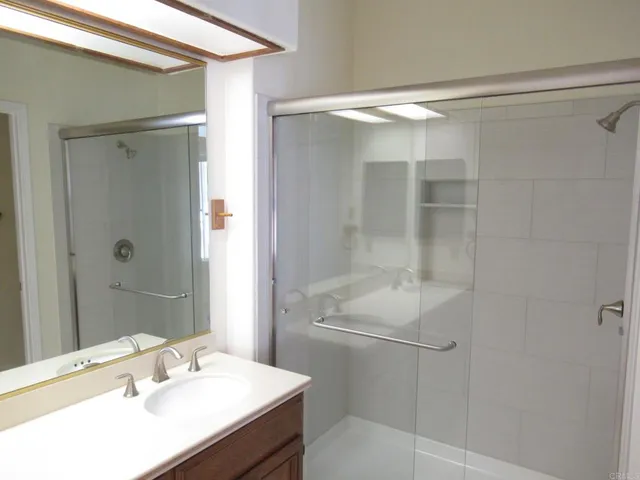 an aerial view of residential houses with outdoor space and mountain view