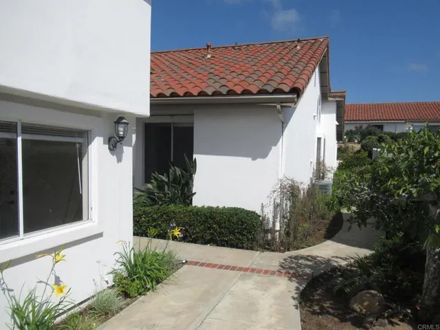 an aerial view of residential house with outdoor space and swimming pool