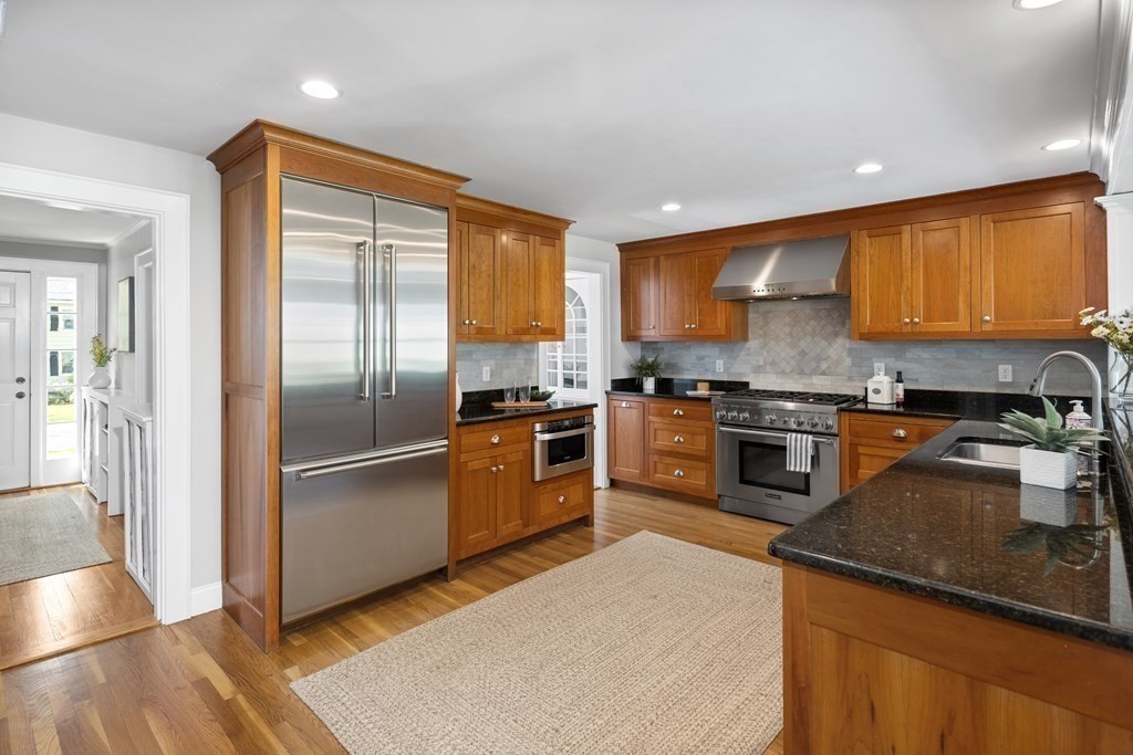 43 Bertwell Road Lexington, MA 02420 - Photo 11 of 41 a kitchen with granite countertop stainless steel appliances and wooden cabinets