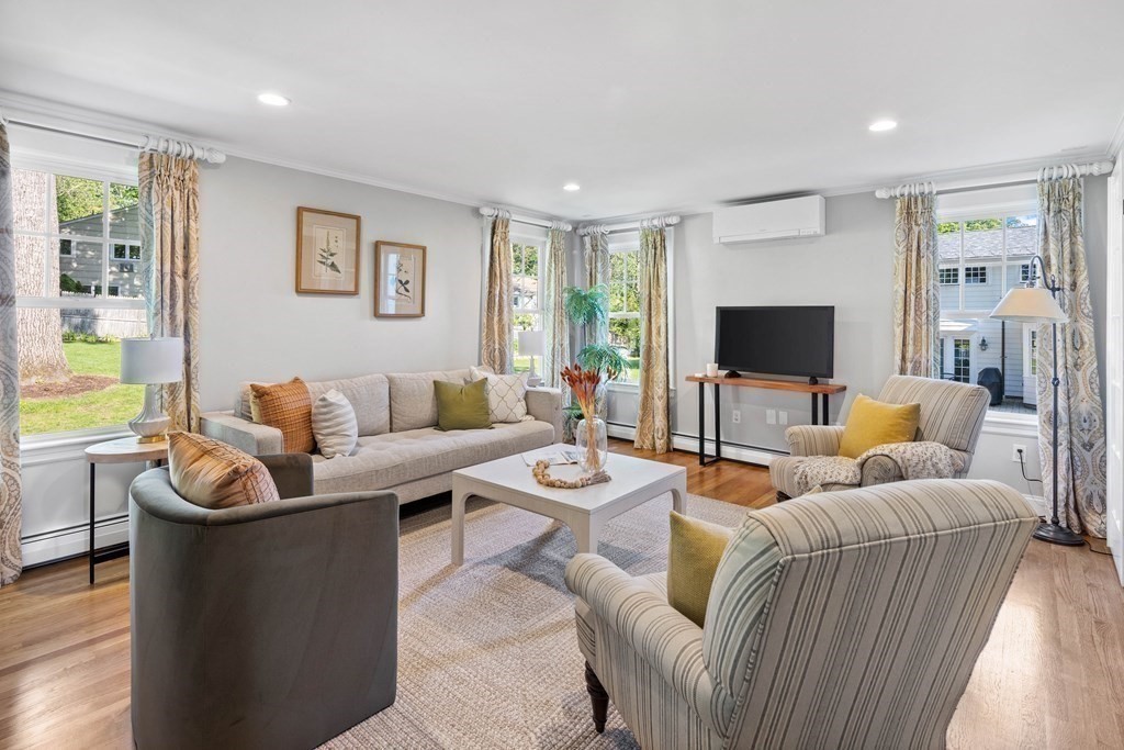 43 Bertwell Road Lexington, MA 02420 - Photo 15 of 41 a living room with furniture and a flat screen tv