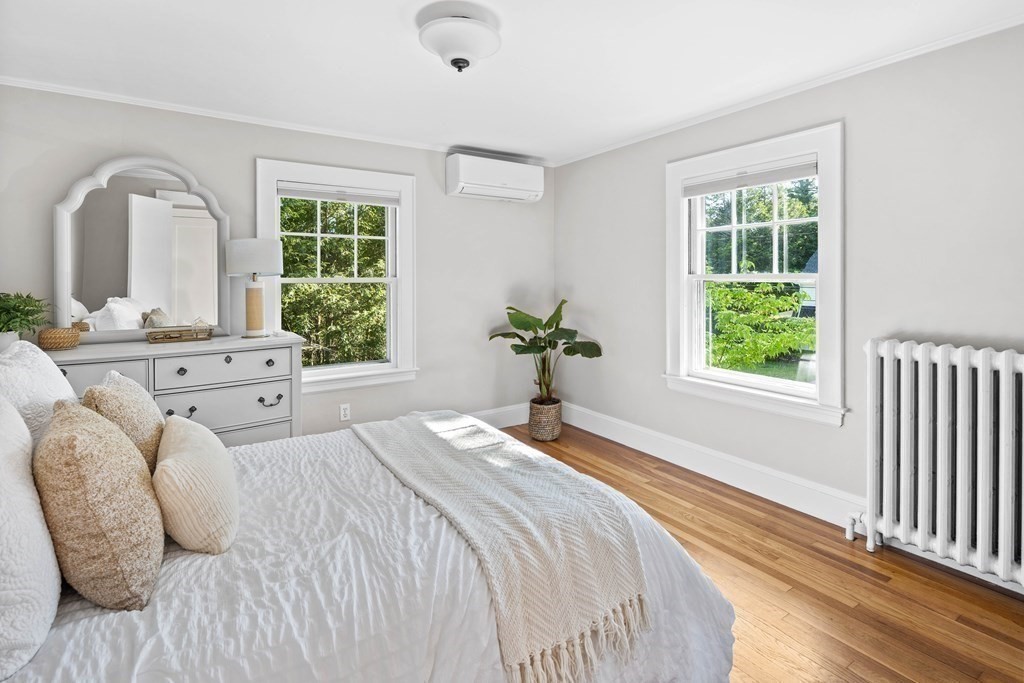 43 Bertwell Road Lexington, MA 02420 - Photo 22 of 41 a bedroom with a bed and a large window