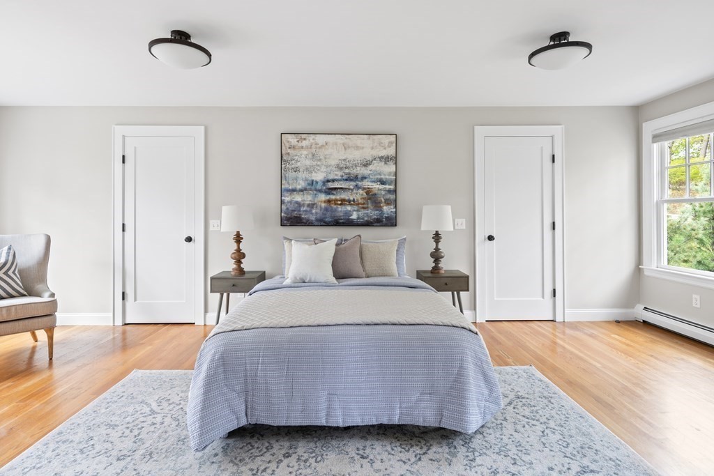 43 Bertwell Road Lexington, MA 02420 - Photo 24 of 41 a bedroom with a bed and a table