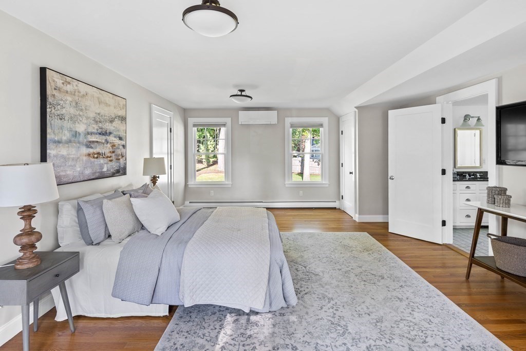 43 Bertwell Road Lexington, MA 02420 - Photo 26 of 41 a spacious bedroom with a large bed and a table