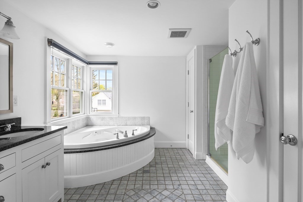 43 Bertwell Road Lexington, MA 02420 - Photo 28 of 41 a bathroom with a sink a toilet a window and shower