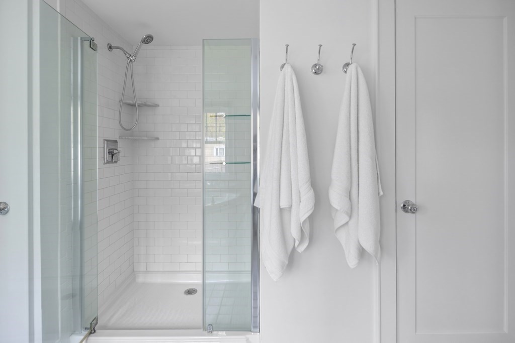 43 Bertwell Road Lexington, MA 02420 - Photo 29 of 41 a bathroom with a shower and a glass door