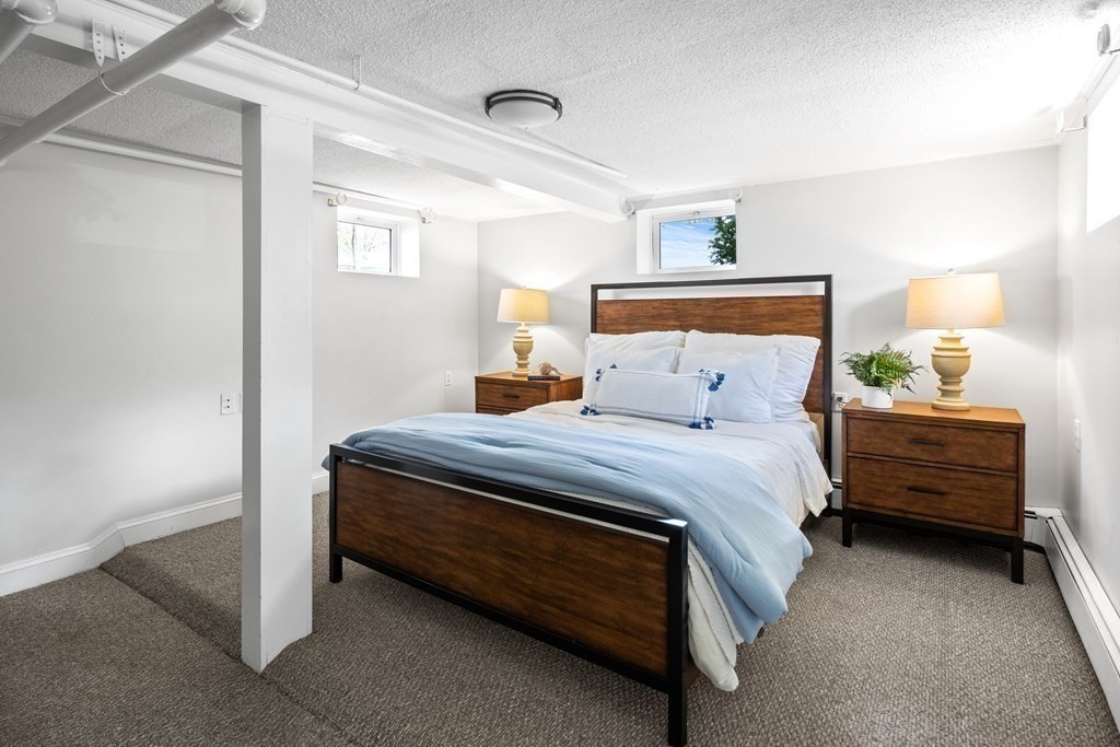 43 Bertwell Road Lexington, MA 02420 - Photo 34 of 41 a bed room with a bed and a night stand