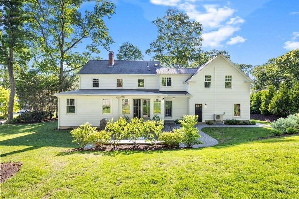 43 Bertwell Road Lexington, MA 02420 - Photo 38 of 41 a front view of a house with a yard