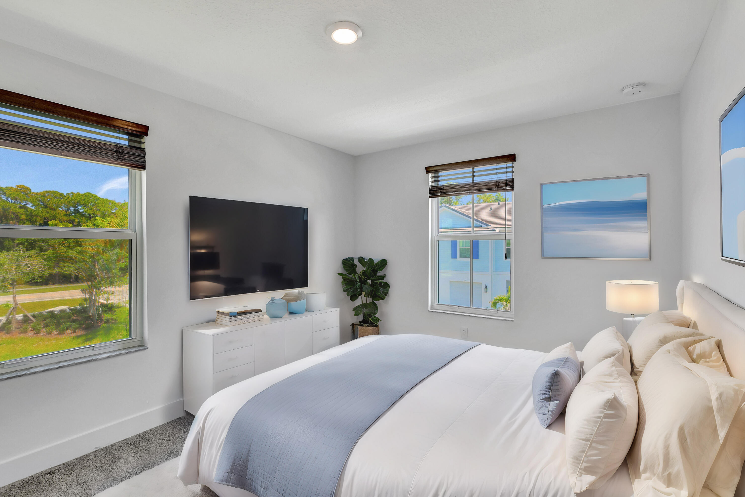 229 Preserve Trail South Stuart, FL 34994 - Photo 13 of 60 a bedroom with a bed and a flat screen tv