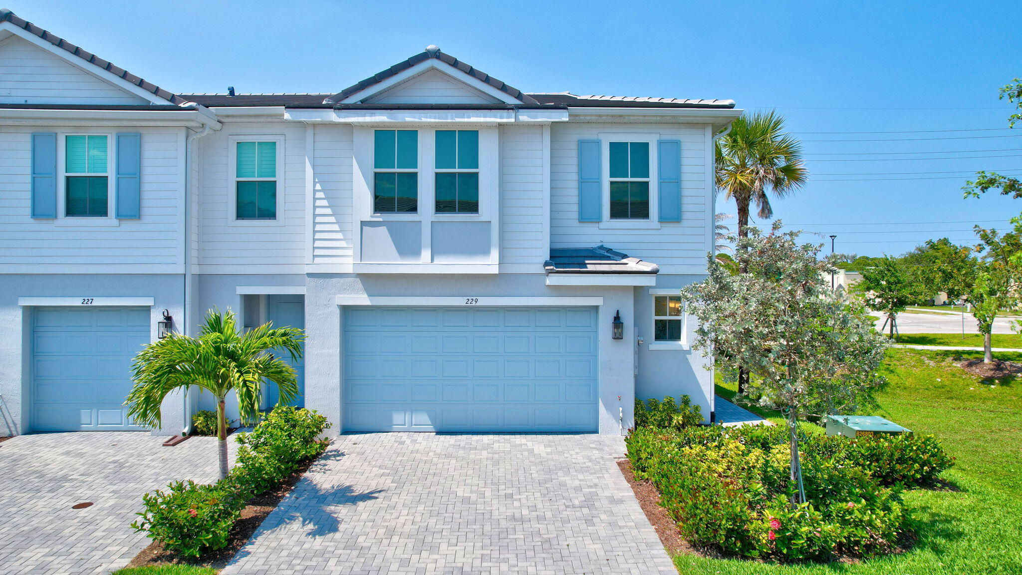229 Preserve Trail South Stuart, FL 34994 - Photo 2 of 60 a front view of a house with garden