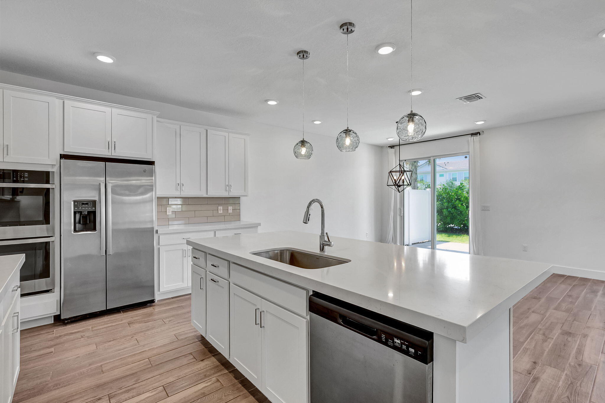 229 Preserve Trail South Stuart, FL 34994 - Photo 21 of 60 a kitchen that has a sink a refrigerator and window