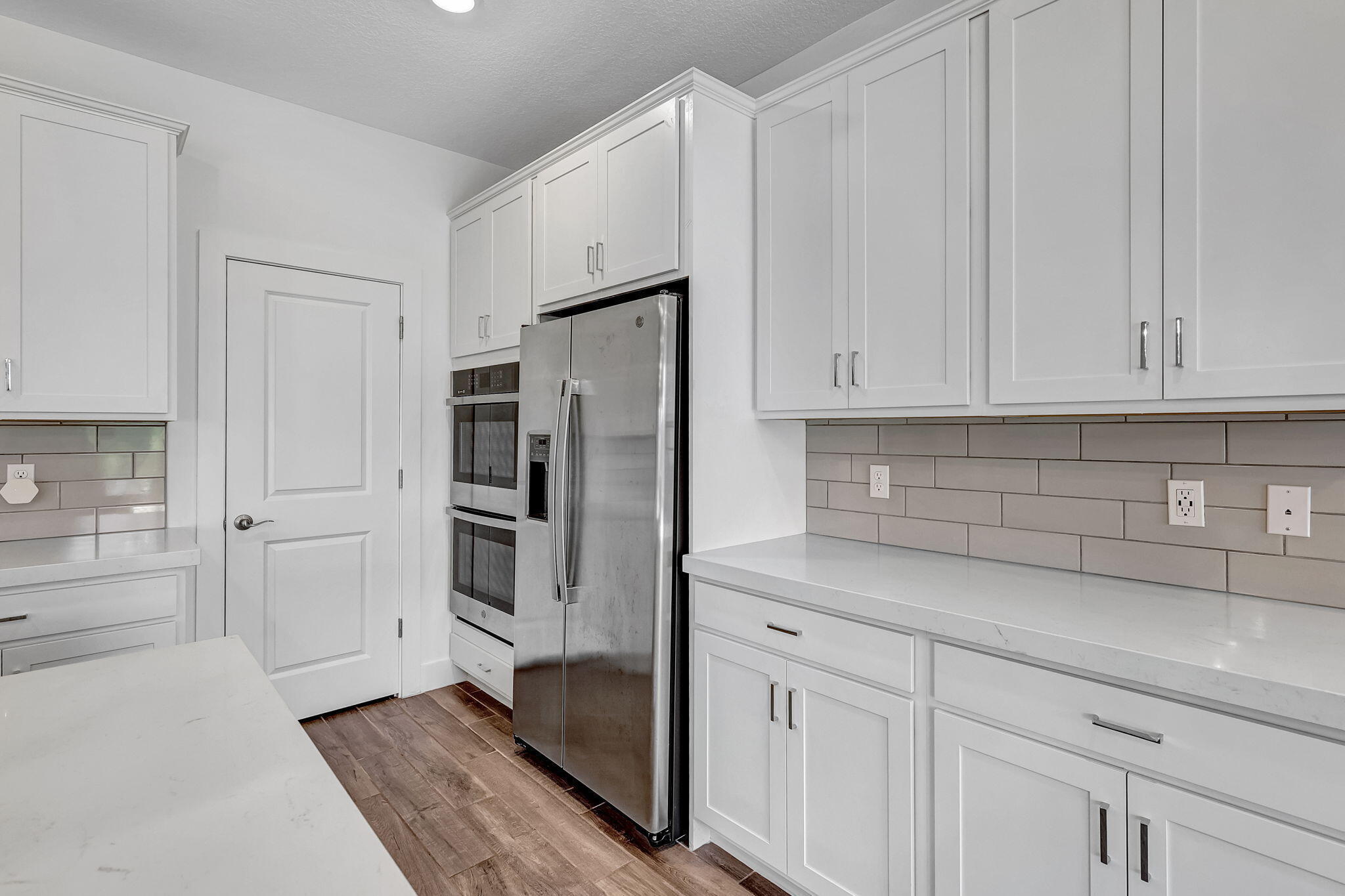 229 Preserve Trail South Stuart, FL 34994 - Photo 22 of 60 a kitchen with white cabinets and refrigerator