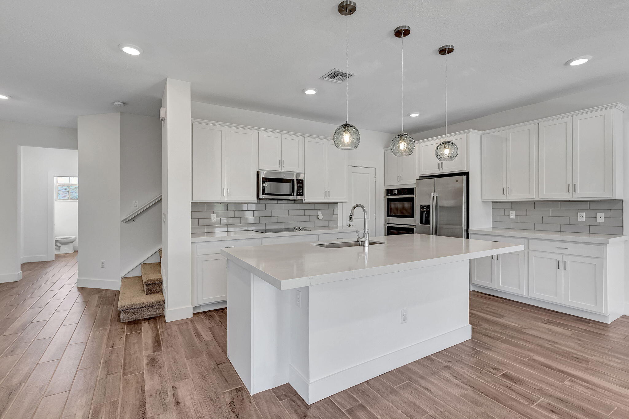 229 Preserve Trail South Stuart, FL 34994 - Photo 24 of 60 a large white kitchen with stainless steel appliances