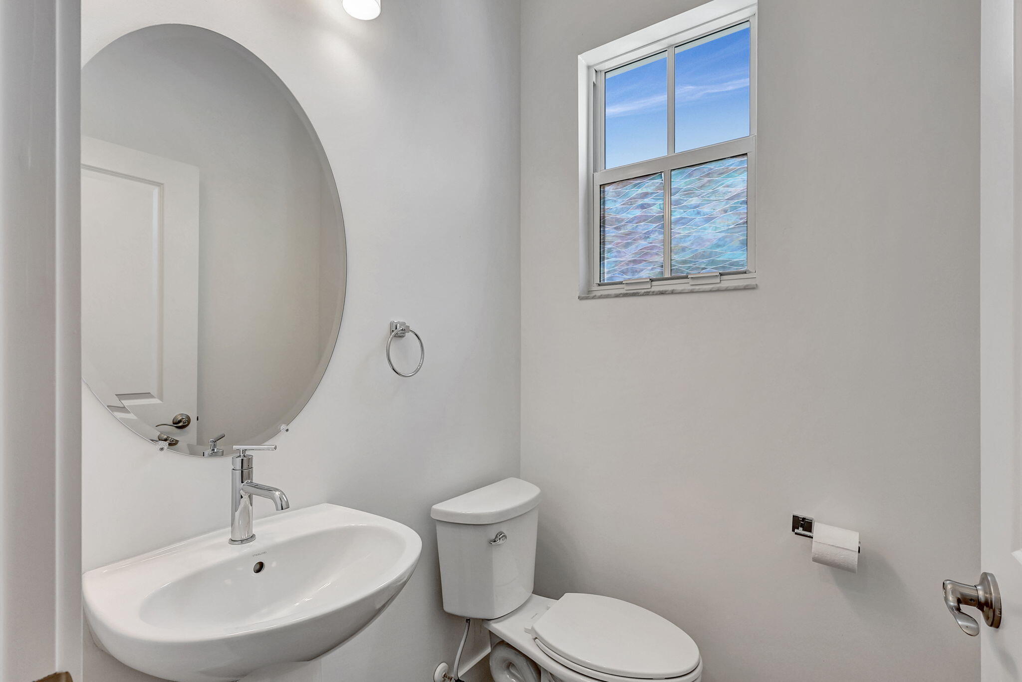 229 Preserve Trail South Stuart, FL 34994 - Photo 29 of 60 a bathroom with a toilet sink and mirror