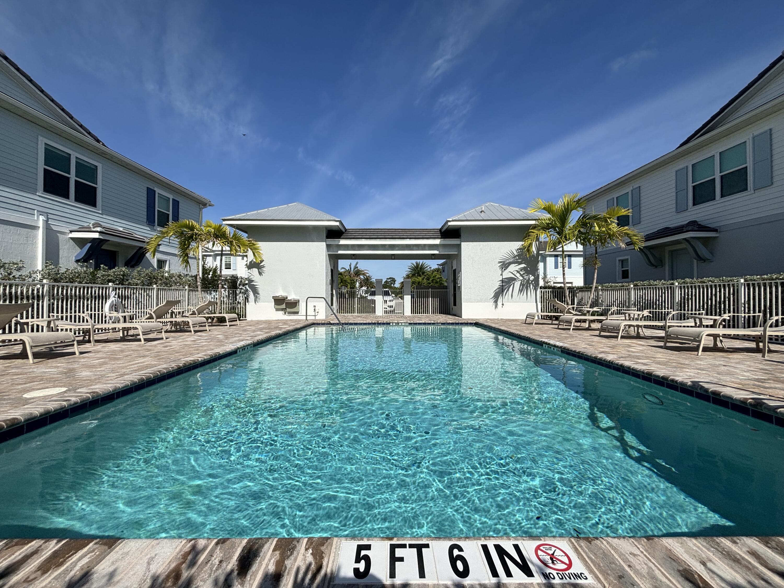 229 Preserve Trail South Stuart, FL 34994 - Photo 59 of 60 a swimming pool with outdoor seating and yard