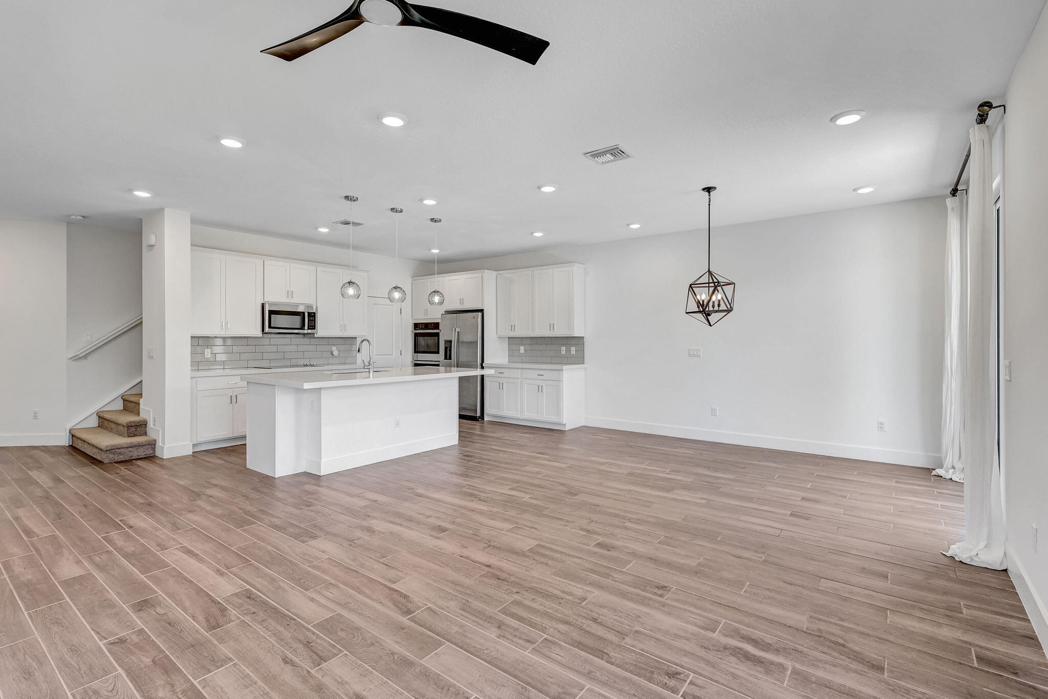 229 Preserve Trail South Stuart, FL 34994 - Photo 6 of 60 a view of kitchen with cabinets and wooden floor