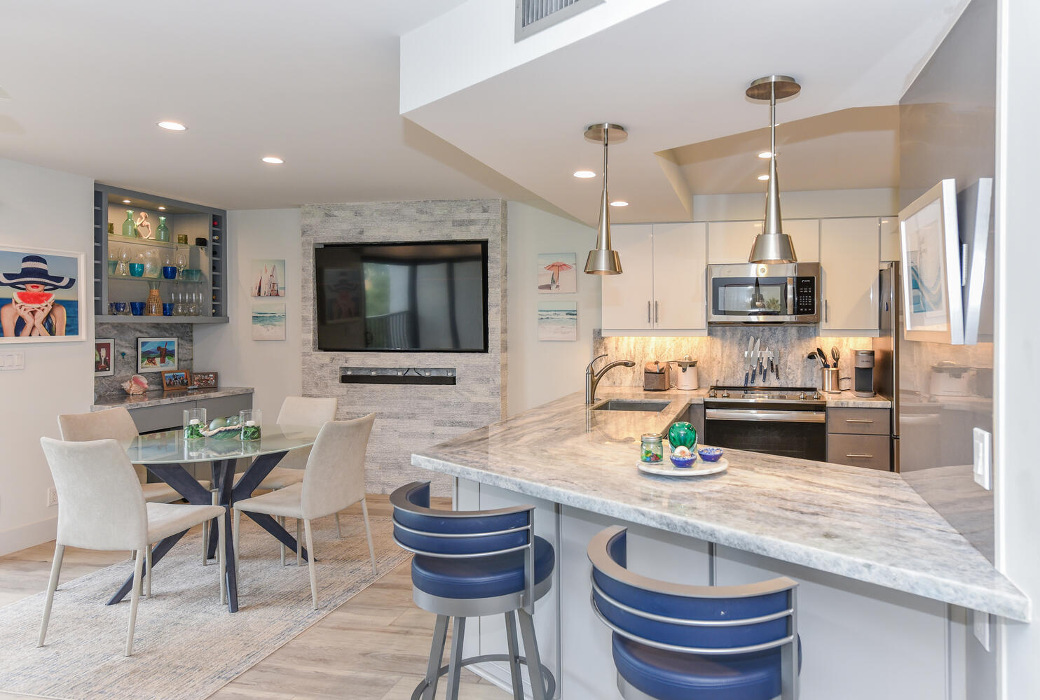 1605 Highway 1, Unit B302 Jupiter, FL 33477 - Photo 11 of 47 a kitchen with granite countertop kitchen island stainless steel appliances a sink and a center island