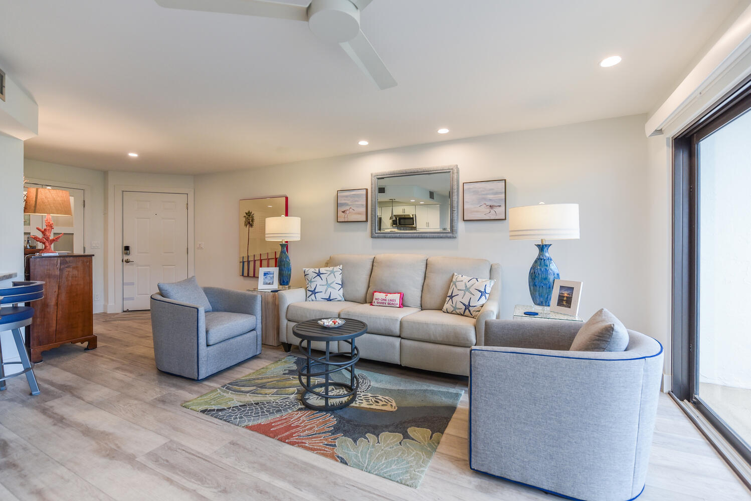 1605 Highway 1, Unit B302 Jupiter, FL 33477 - Photo 12 of 47 a living room with furniture and a wooden floor