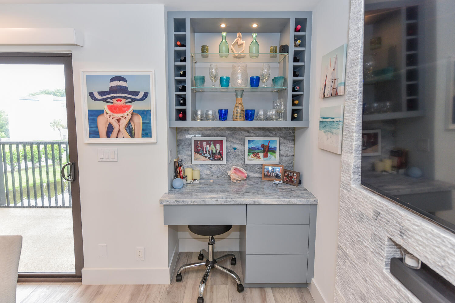 1605 Highway 1, Unit B302 Jupiter, FL 33477 - Photo 17 of 47 a dining room with a wooden floor and a book shelf