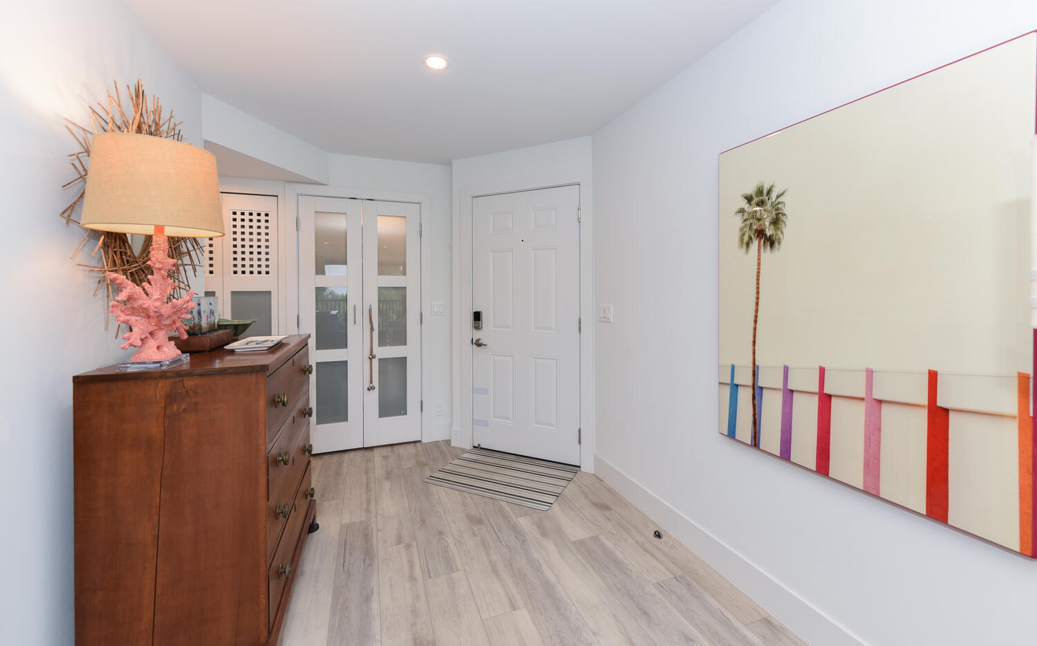 1605 Highway 1, Unit B302 Jupiter, FL 33477 - Photo 3 of 47 a view of hallway with furniture and a wooden floor