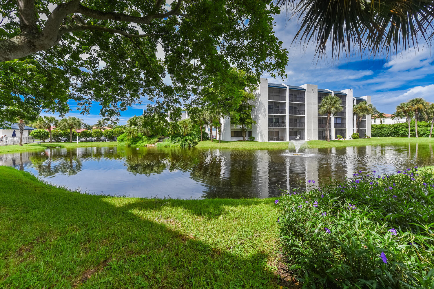 1605 Highway 1, Unit B302 Jupiter, FL 33477 - Photo 37 of 47 front view of a house with a yard
