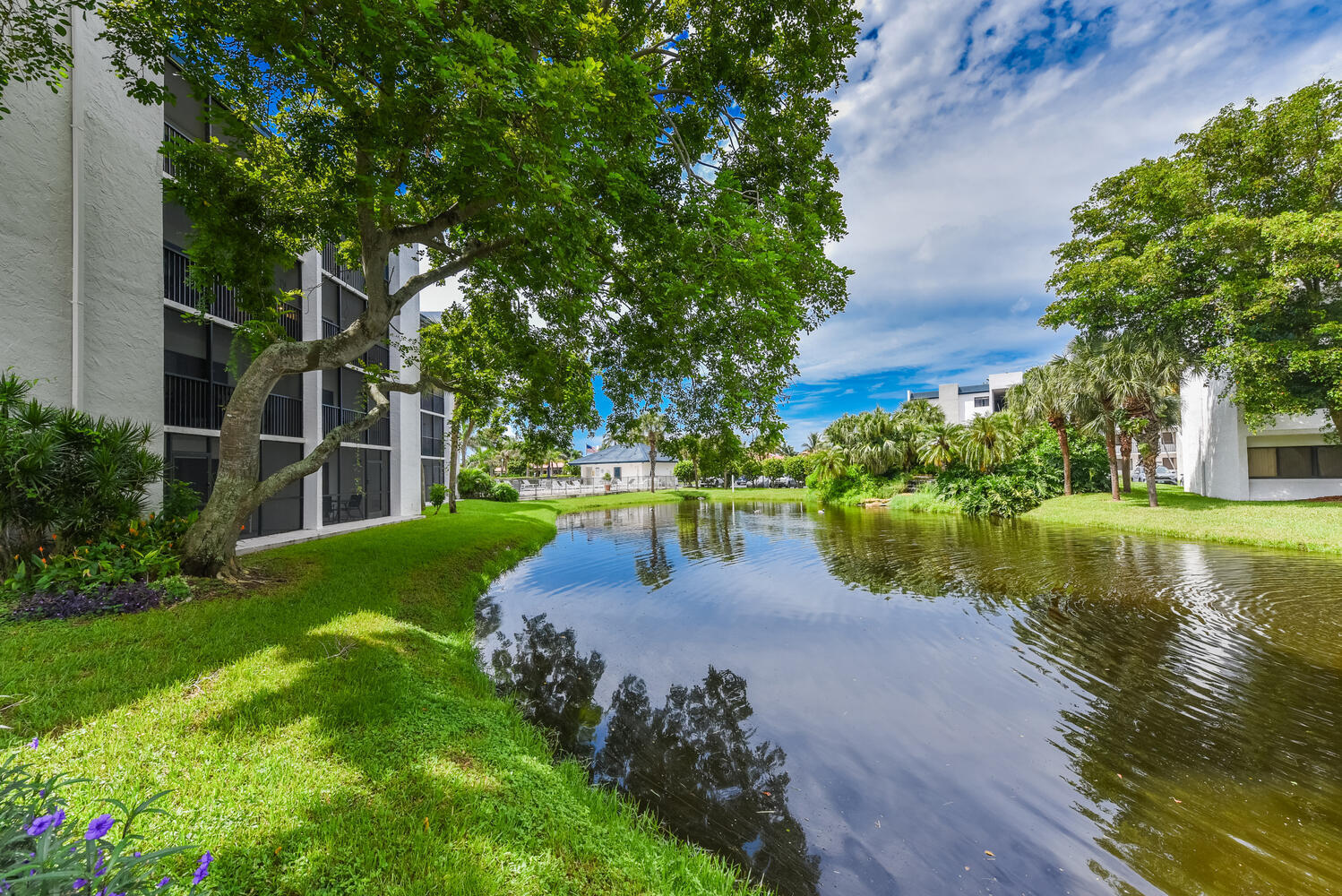 1605 Highway 1, Unit B302 Jupiter, FL 33477 - Photo 38 of 47 a view of a lake with a garden
