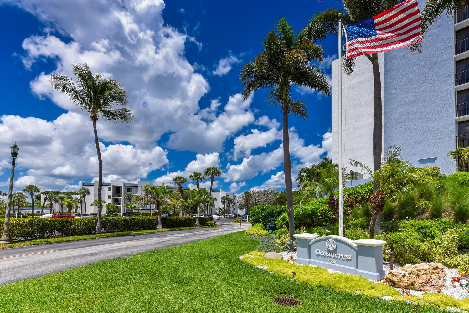 1605 Highway 1, Unit B302 Jupiter, FL 33477 - Photo 46 of 47 a view of a chair and tables in the garden