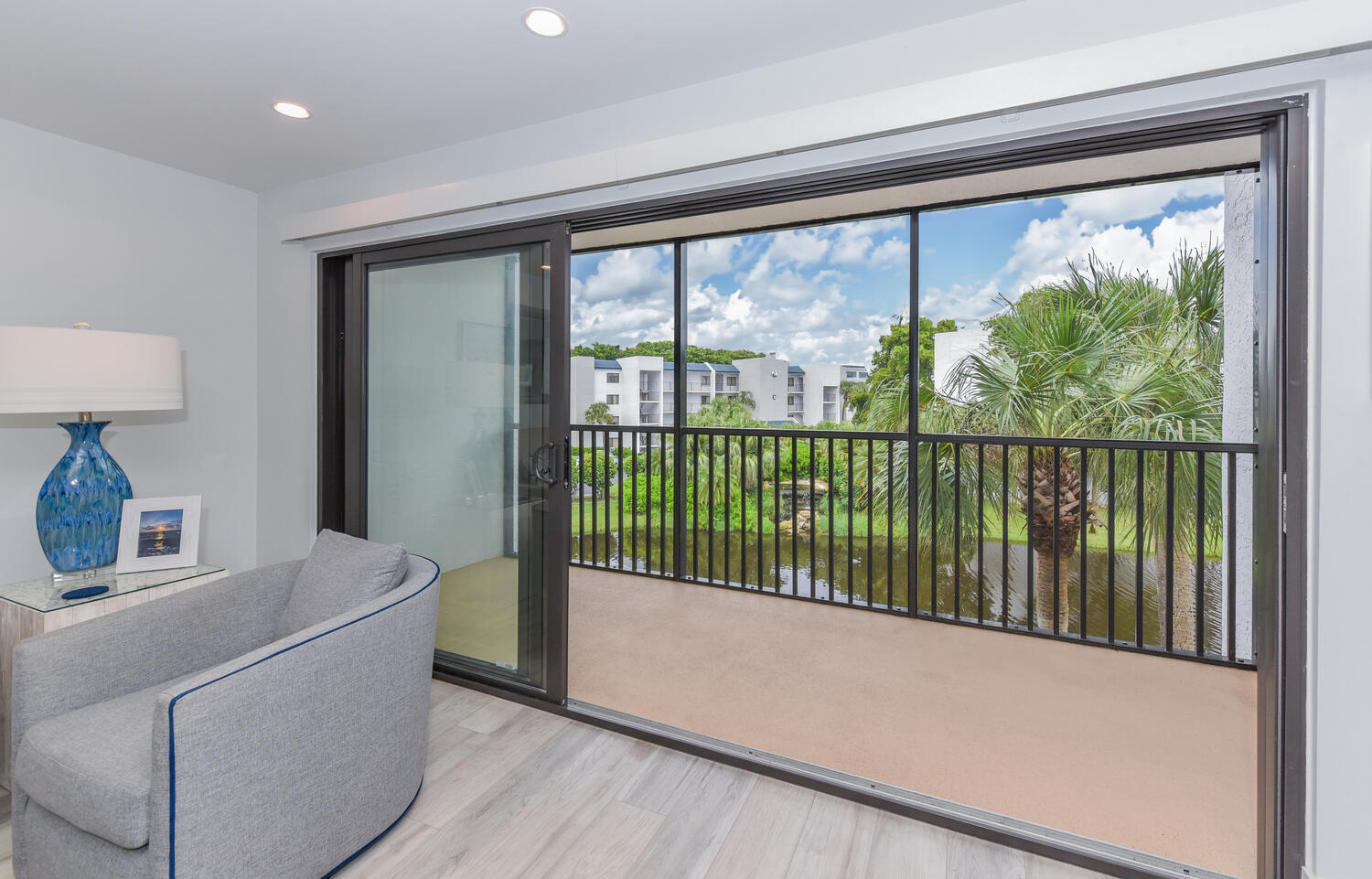 1605 Highway 1, Unit B302 Jupiter, FL 33477 - Photo 9 of 47 a living room with a large window